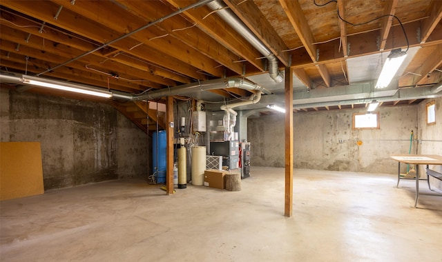 unfinished below grade area featuring heating unit