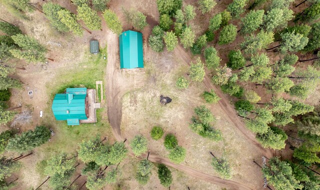 exterior space with a forest view