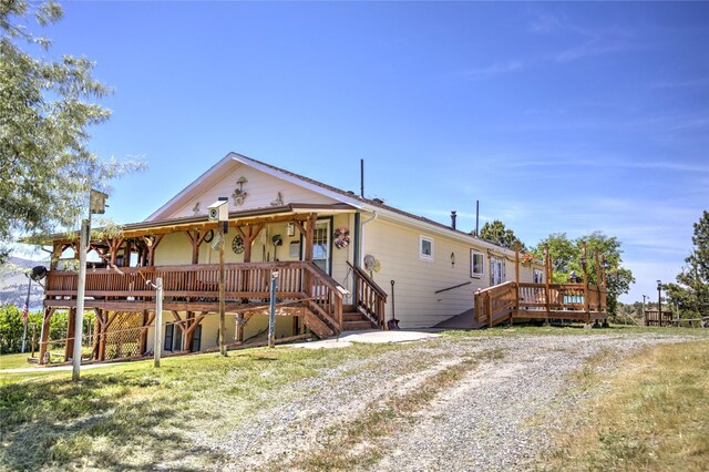 view of front of property with a wooden deck