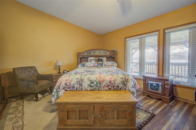 bedroom featuring vaulted ceiling and wood finished floors