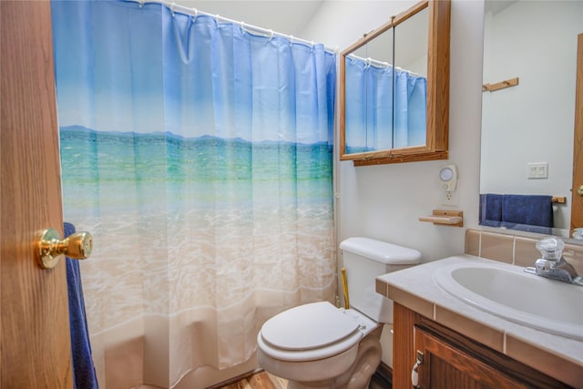 full bathroom with toilet, shower / tub combo with curtain, and vanity