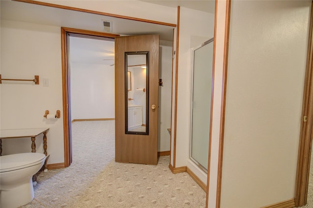 full bathroom with baseboards, a stall shower, visible vents, and toilet