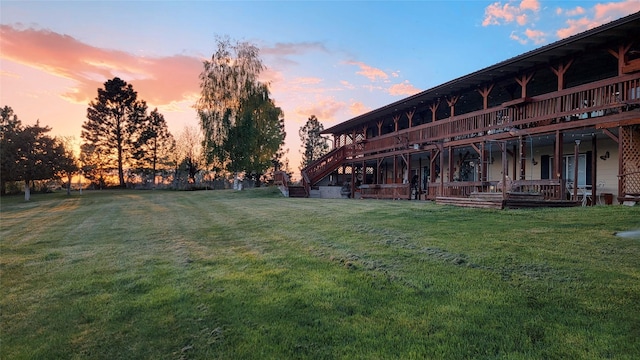 yard at dusk with a wooden deck
