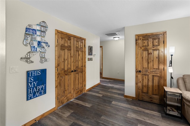 70 Moccasin Ln, Thompson Falls, MT 59873 - hallway with dark wood-type flooring and baseboards