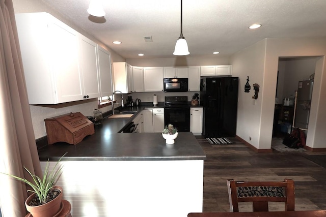 kitchen with white cabinets, a sink, baseboards, dark wood-type flooring, and black appliances