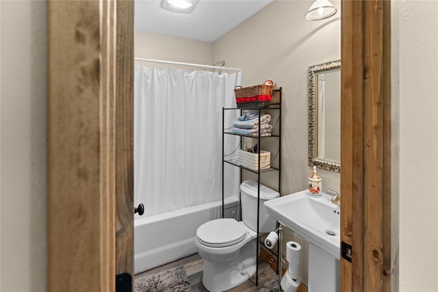70 Moccasin Ln, Thompson Falls, MT 59873 - bathroom featuring toilet, shower / bath combo, and wood finished floors