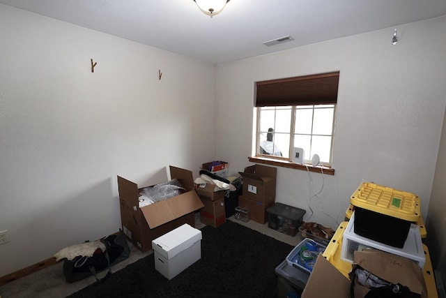interior space featuring visible vents and carpet floors