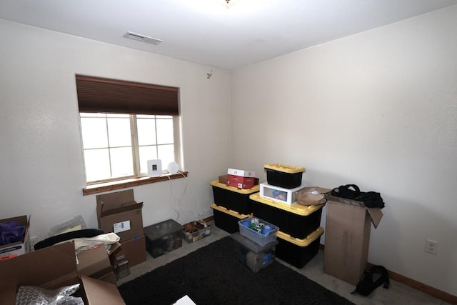 carpeted office space with visible vents