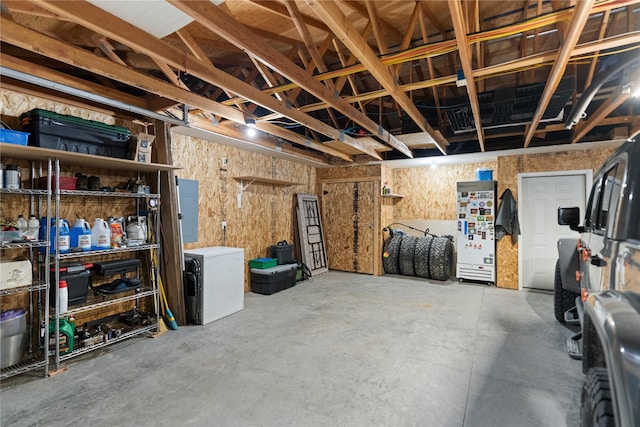 70 Moccasin Ln, Thompson Falls, MT 59873 - basement featuring a garage, electric panel, and fridge