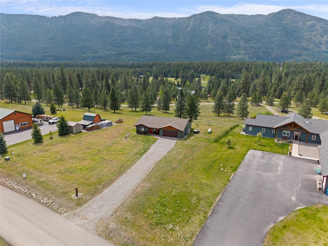 70 Moccasin Ln, Thompson Falls, MT 59873 - aerial view of property and surrounding area featuring a mountainous background and a forest