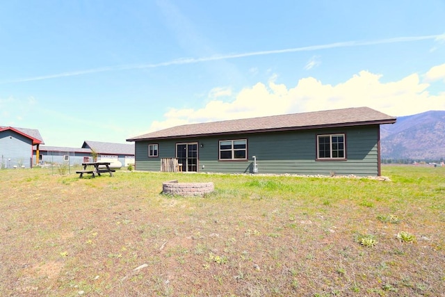 back of property with a mountain view