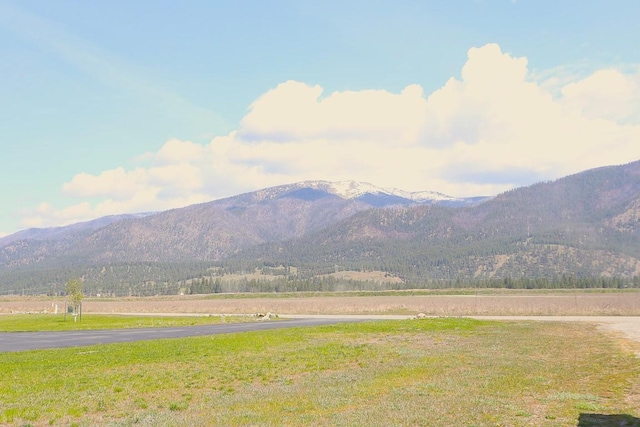 mountain view featuring a rural view