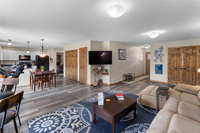 70 Moccasin Ln, Thompson Falls, MT 59873 - living area featuring wood finished floors and baseboards