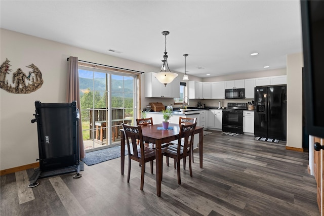 70 Moccasin Ln, Thompson Falls, MT 59873 - dining area with dark wood finished floors, baseboards, and recessed lighting