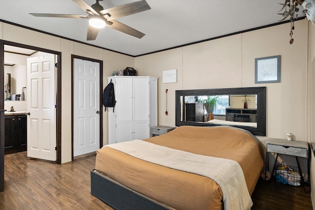 110 Van Sant Rd Unit 4, Kalispell, MT 59901 - bedroom featuring crown molding, wood finished floors, a textured ceiling, a ceiling fan, and connected bathroom