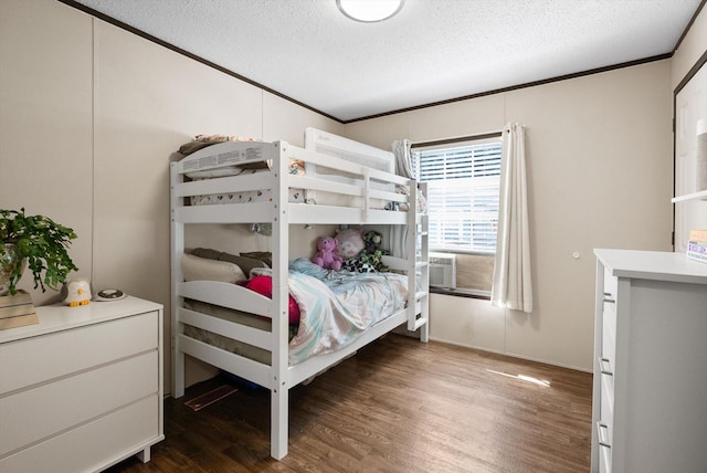 110 Van Sant Rd Unit 4, Kalispell, MT 59901 - bedroom with a textured ceiling, wood finished floors, and crown molding