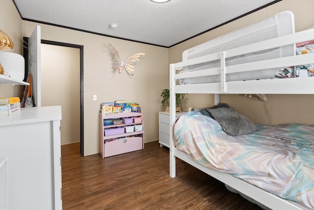 110 Van Sant Rd Unit 4, Kalispell, MT 59901 - bedroom with wood finished floors, a textured ceiling, and crown molding