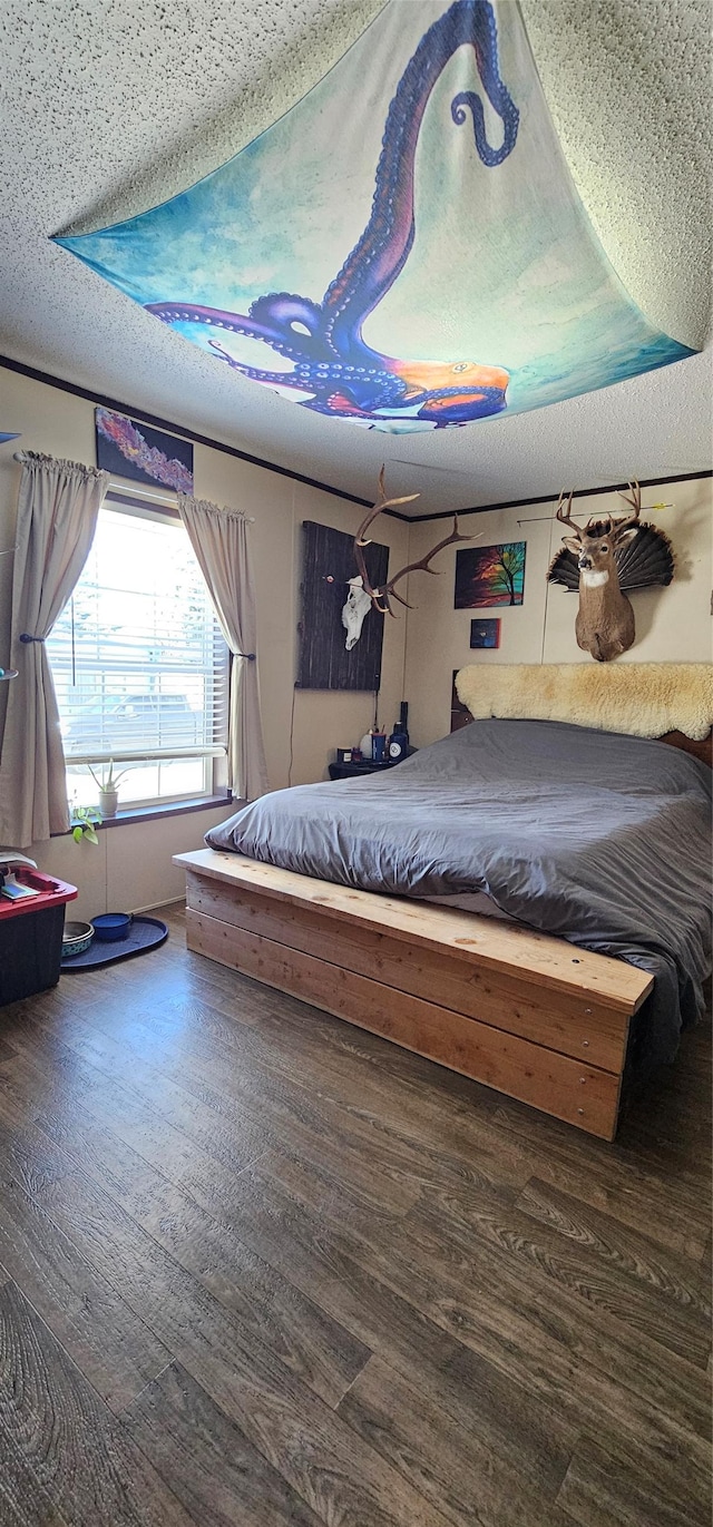 bedroom with wood finished floors