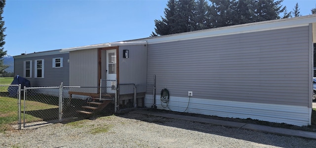 exterior space featuring fence private yard and a gate