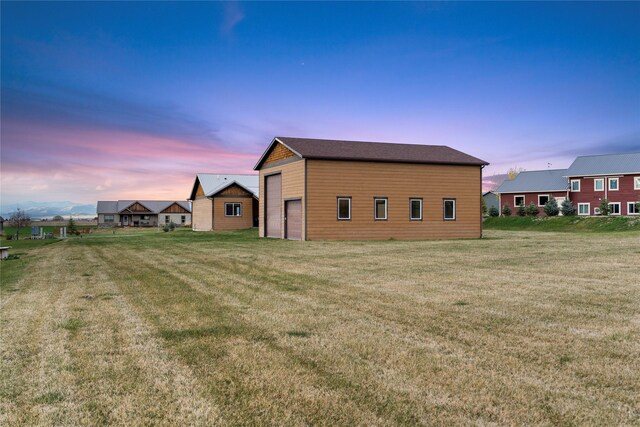 20 Windy Meadow Dr, Townsend, MT 59644 - back of house featuring a lawn and an outbuilding