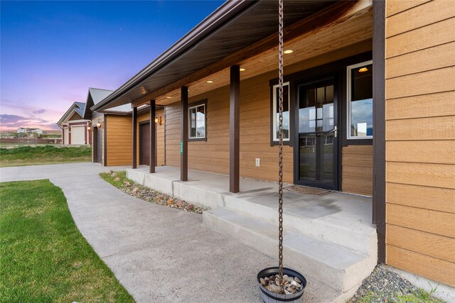 20 Windy Meadow Dr, Townsend, MT 59644 - view of property exterior featuring a garage and covered porch