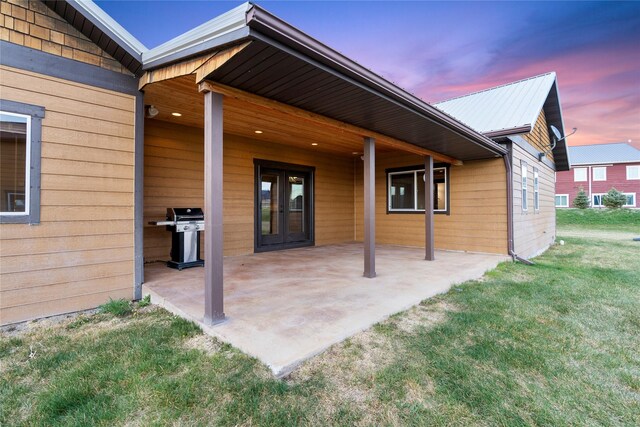 20 Windy Meadow Dr, Townsend, MT 59644 - unfurnished living room featuring wood-type flooring, baseboards, ceiling fan with notable chandelier, and high vaulted ceiling