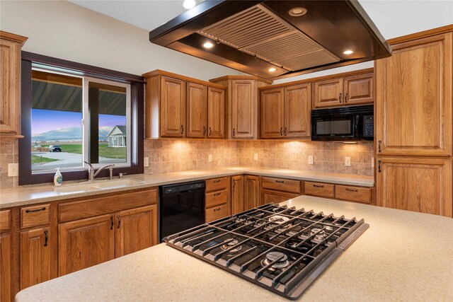 20 Windy Meadow Dr, Townsend, MT 59644 - kitchen featuring a sink, light countertops, wall chimney exhaust hood, decorative backsplash, and black appliances