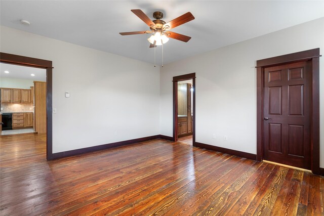 20 Windy Meadow Dr, Townsend, MT 59644 - unfurnished room featuring baseboards, a ceiling fan, and dark wood finished floors