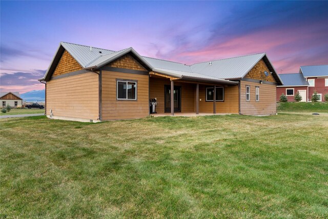 20 Windy Meadow Dr, Townsend, MT 59644 - back of house featuring a yard, a patio area, and metal roof
