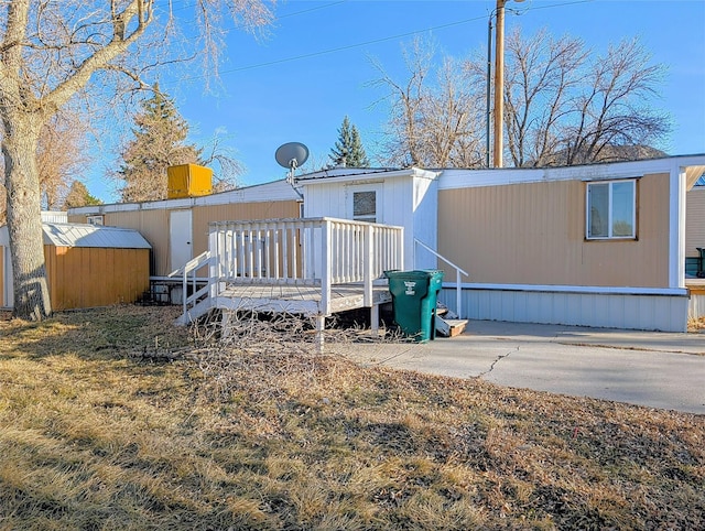 back of property with a deck