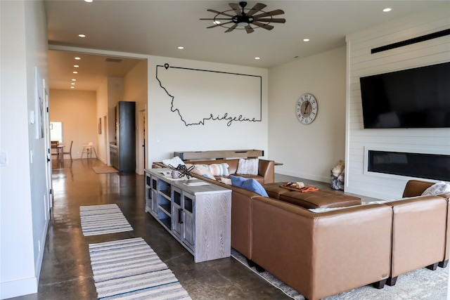 288 Costich Lake Rd, Eureka, MT 59917 - living area with a large fireplace, a ceiling fan, recessed lighting, and visible vents