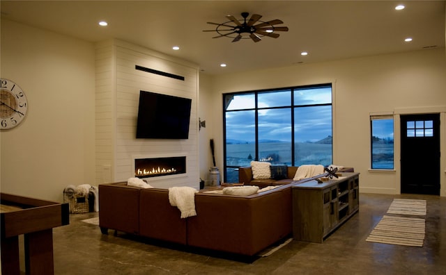 288 Costich Lake Rd, Eureka, MT 59917 - living area with recessed lighting, finished concrete floors, and a fireplace