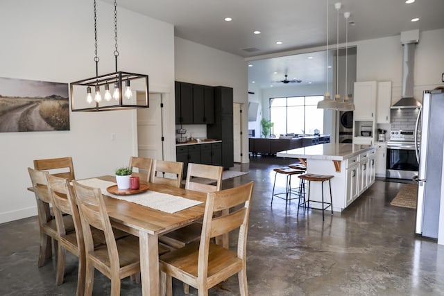 dining room with washer / dryer, recessed lighting, finished concrete floors, and visible vents