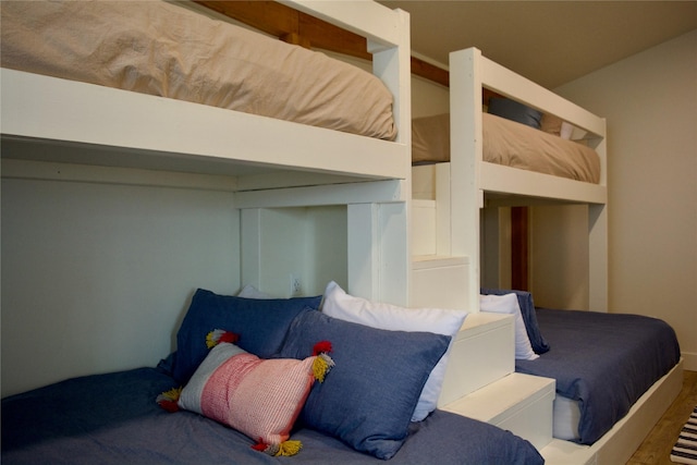 bedroom with wood finished floors