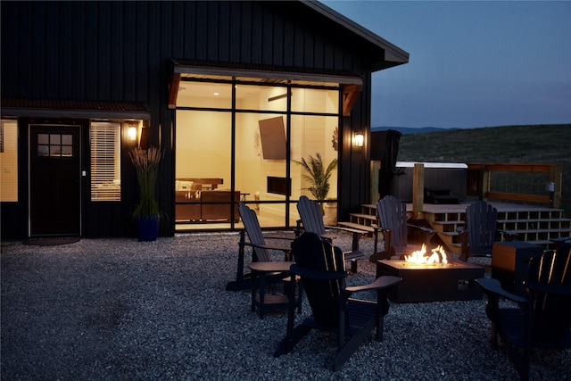 288 Costich Lake Rd, Eureka, MT 59917 - patio at twilight with an outdoor fire pit