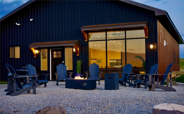 288 Costich Lake Rd, Eureka, MT 59917 - rear view of house with a fire pit and a patio area