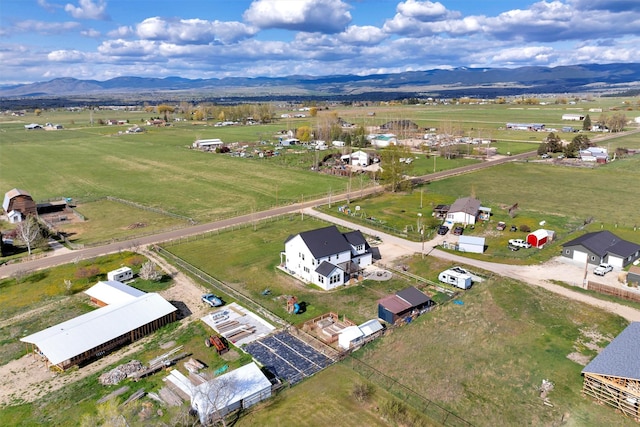aerial view with a mountain view and a rural view