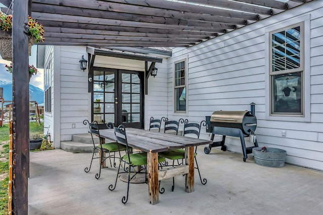 685 Hollibaugh Rd, Stevensville, MT 59870 - view of patio / terrace with outdoor dining space, french doors, grilling area, and a pergola