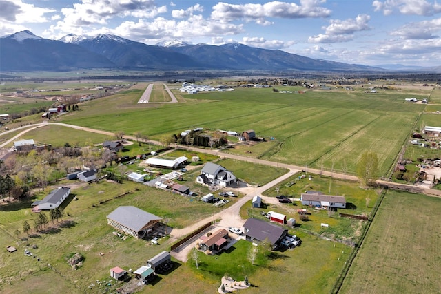 birds eye view of property with a rural view and a mountain view