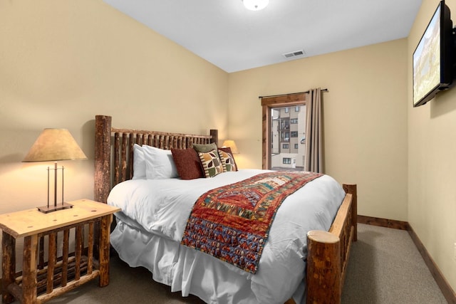 bedroom featuring baseboards, carpet, and visible vents