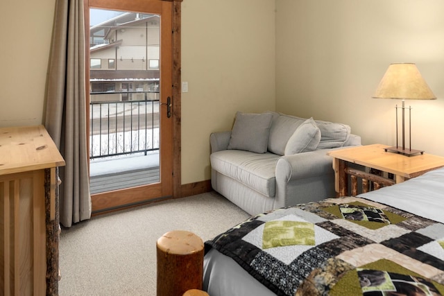 carpeted bedroom featuring access to outside