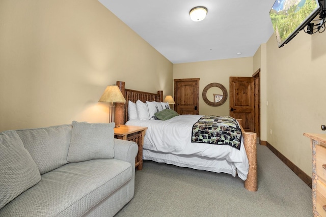 carpeted bedroom with baseboards