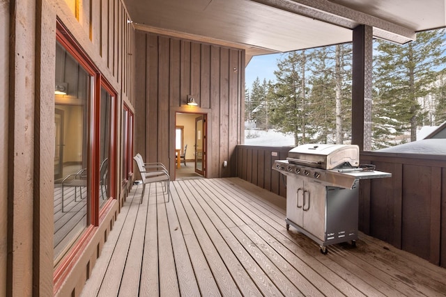 snow covered deck with grilling area