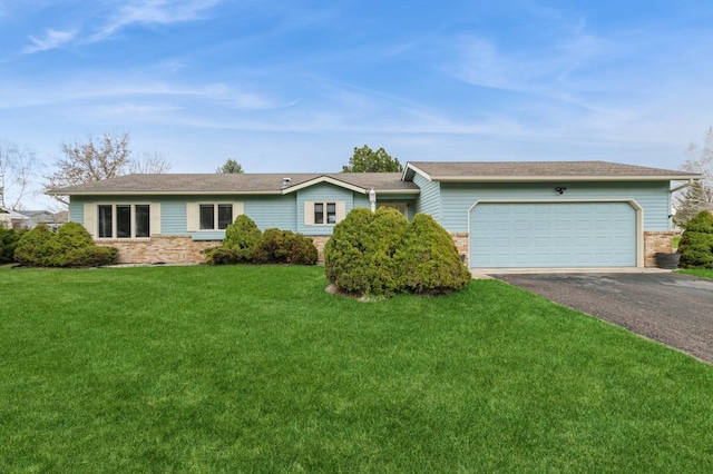 ranch-style house with an attached garage, aphalt driveway, a front lawn, and brick siding