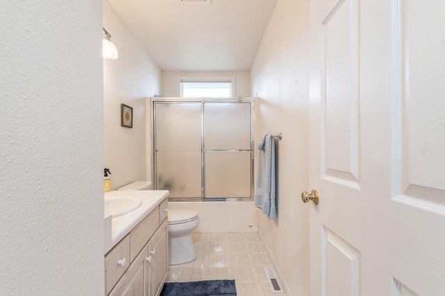 full bath with vanity, toilet, shower / bath combination with glass door, and visible vents