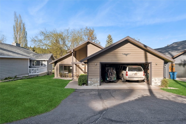 85 Golf Ter, Bigfork, MT 59911 - view of front facade with a garage, driveway, and a front lawn