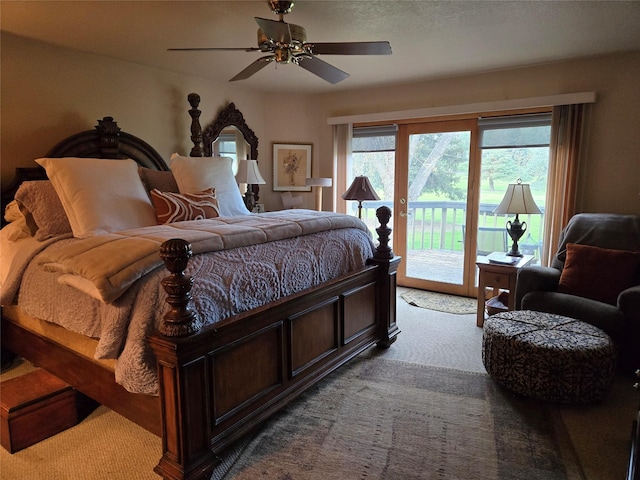 carpeted bedroom featuring access to outside and a ceiling fan