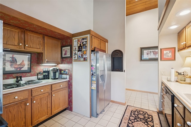 85 Golf Ter, Bigfork, MT 59911 - kitchen with stainless steel fridge, electric stovetop, dishwasher, and light countertops