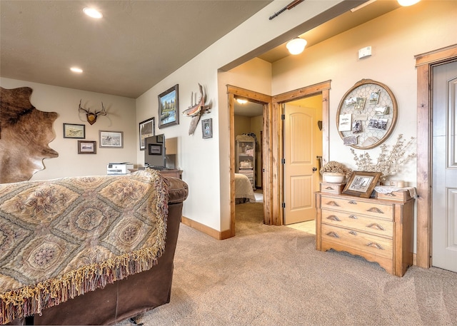 interior space featuring baseboards, light carpet, and recessed lighting