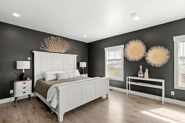 3201 12th St NE, Great Falls, MT 59404 - bedroom with recessed lighting, baseboards, and wood finished floors